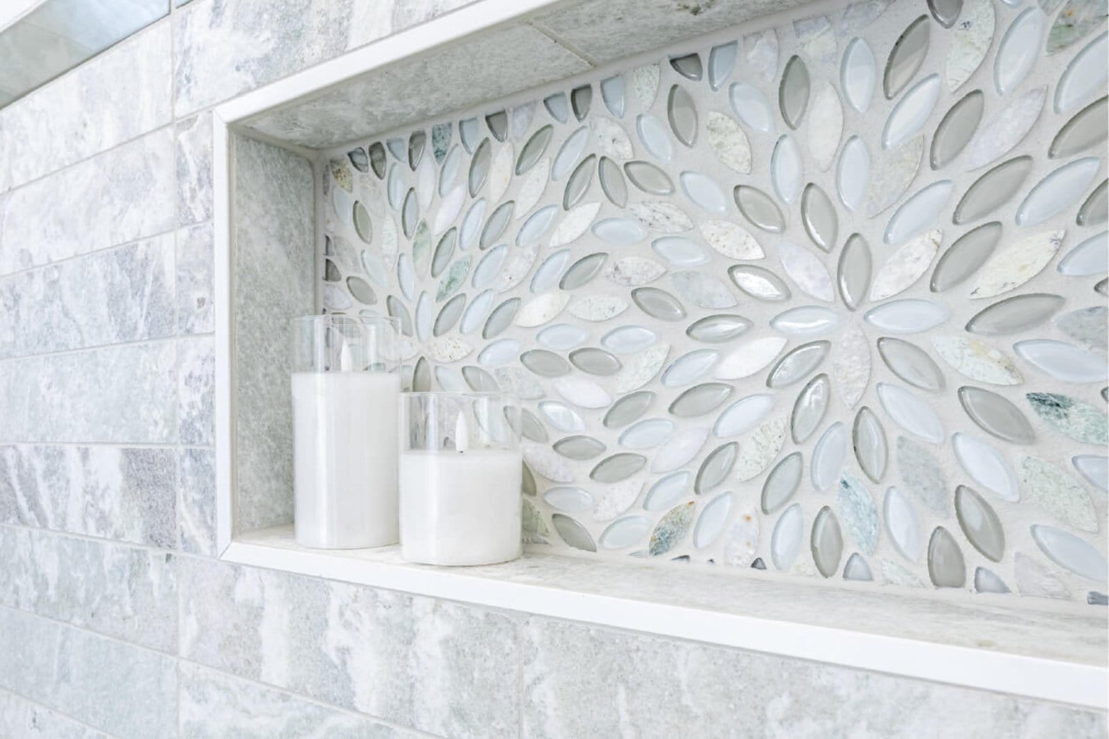 Precision shower niche tile detail from a luxury bathroom remodel completed by Tranquil Kitchen & Bath in Cincinnati, Ohio.